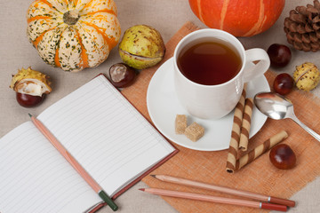 Opened Notebook. Cup Of Hot Tea With Sweets. Natural Linen Table