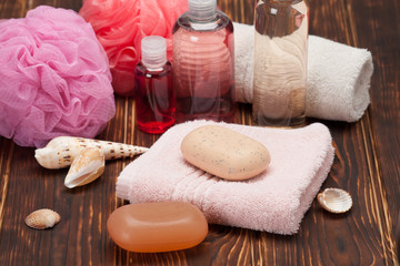 Spa Kit. Shampoo, Soap, Body Lotion. Towels. Wooden Background
