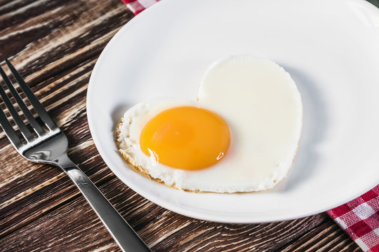 heart-shaped fried eggs in a plate