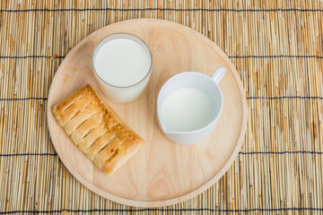 Breakfast pitcher of milk and bread