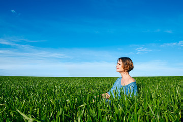 Woman enjoying in green field