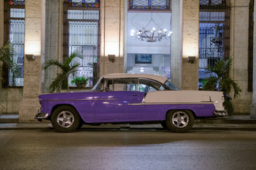 Vintage car at night In Havana, Cuba