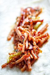 Fried meat with corn on pita bread.