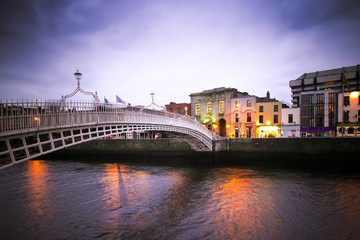 Vintage toned image of historic Ha'penny Bridge over the River Liffey in Dublin Ireland