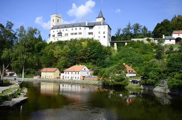 Fototapeta na wymiar Czech Republic, village Rozmberk nad Vltavou with castle and reflection in Moldau river