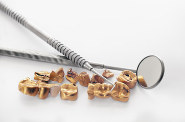 Removed from teeth old golden dental bridge