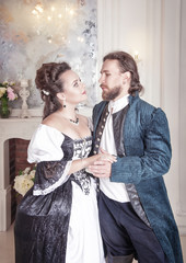 Beautiful couple woman and man in medieval clothes