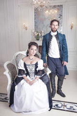 Beautiful couple woman and man in medieval clothes