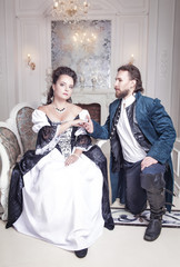 Beautiful couple woman and man in medieval clothes
