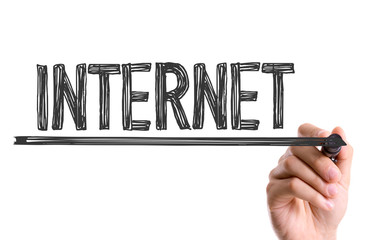 Hand with marker writing the word Internet