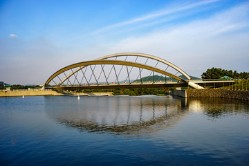 Fototapeta na wymiar Modern architecture design of a pedestrian bridge in Putrajaya, Malaysia