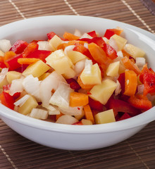 Raw vegetable cut in wooden background close up