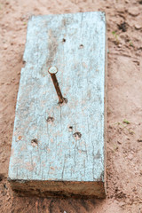 rusty nail in wood