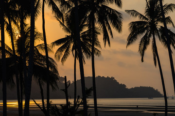 Fototapeta na wymiar Orange sunset on the beach in Thailand.