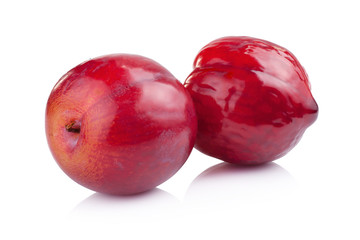 plums isolated on white