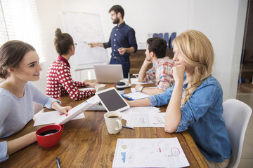 Boss leading a conference in the conference room