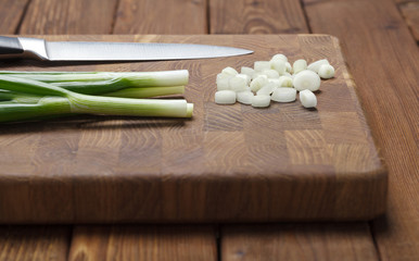 Knife and spring onions
