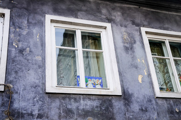 Angels at a white window