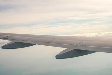 Obraz premium view from the plane on the wing and clouds