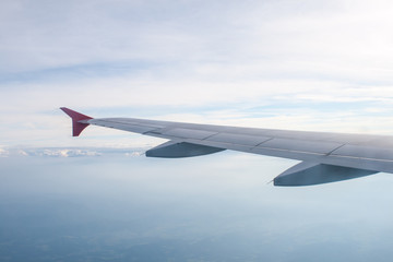 Obraz premium view from the plane on the wing and clouds