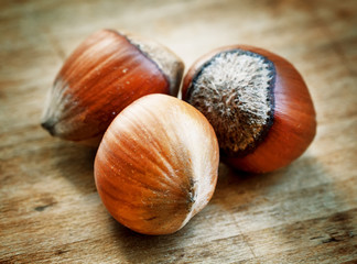 Hazelnuts on old wooden table, selective fokuks