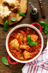 Baked rabbit in tomato sauce with rosemary and basil. Italian Cuisine.
