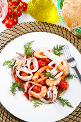 dish with tomatoes and squid