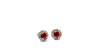 ruby earrings on white background.