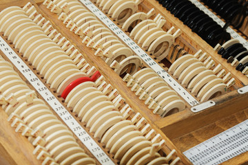 optician with set of trial frames and trial lenses