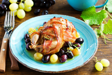 Baked stuffed quail with grape sauce.