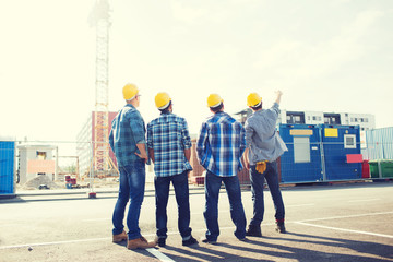 group of builders in hardhats outdoors