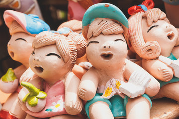 Smiling and laughing clay doll, Happy concept.