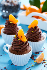 Chocolate cupcakes with orange and chocolate.