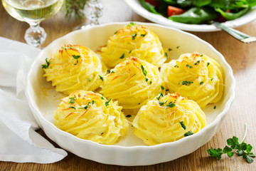 Baked meat with mushrooms in mashed potatoes.