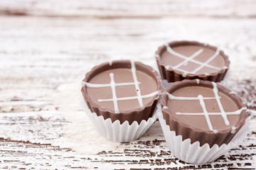Dark chocolate on wooden background