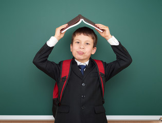 school boy portrait near board