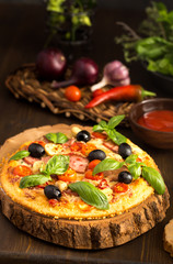 Pizza with salami and mushrooms