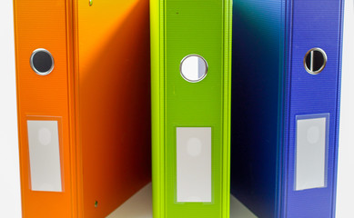 différent colors binders on a white background