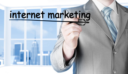 business man writing internet marketing