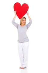 Fototapeta na wymiar pregnant woman holding heart shape