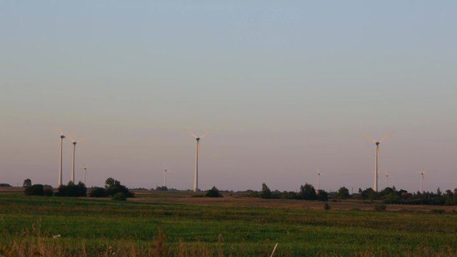 Wind power plant on the field of wheat. Lithuania.