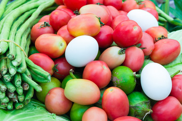 Tomatoes, beans, eggs on the counter market.
