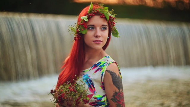 The girl with red hair near the waterfall.