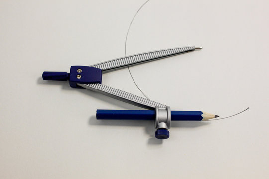 metal compass with blue pencil 
