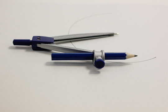 metal compass with blue pencil 