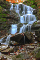 Fototapeta premium waterfall in the autumn forest