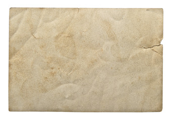 Used paper sheet on white background. Grungy cardboard texture