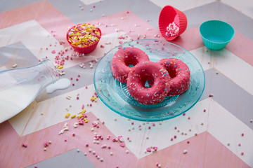 Kids party with milk pink donas and cupcake topings