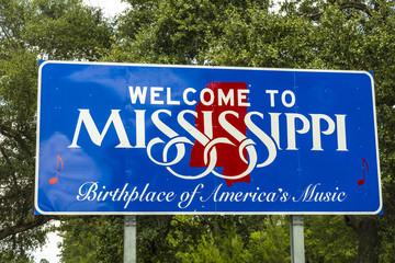 Red, white, and blue sign to welcome travelers to Mississippi -