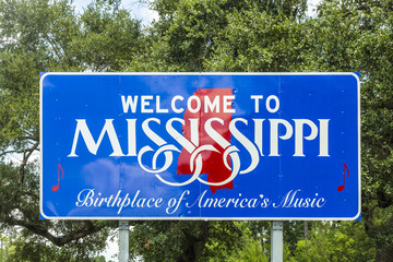 Red, white, and blue sign to welcome travelers to Mississippi -